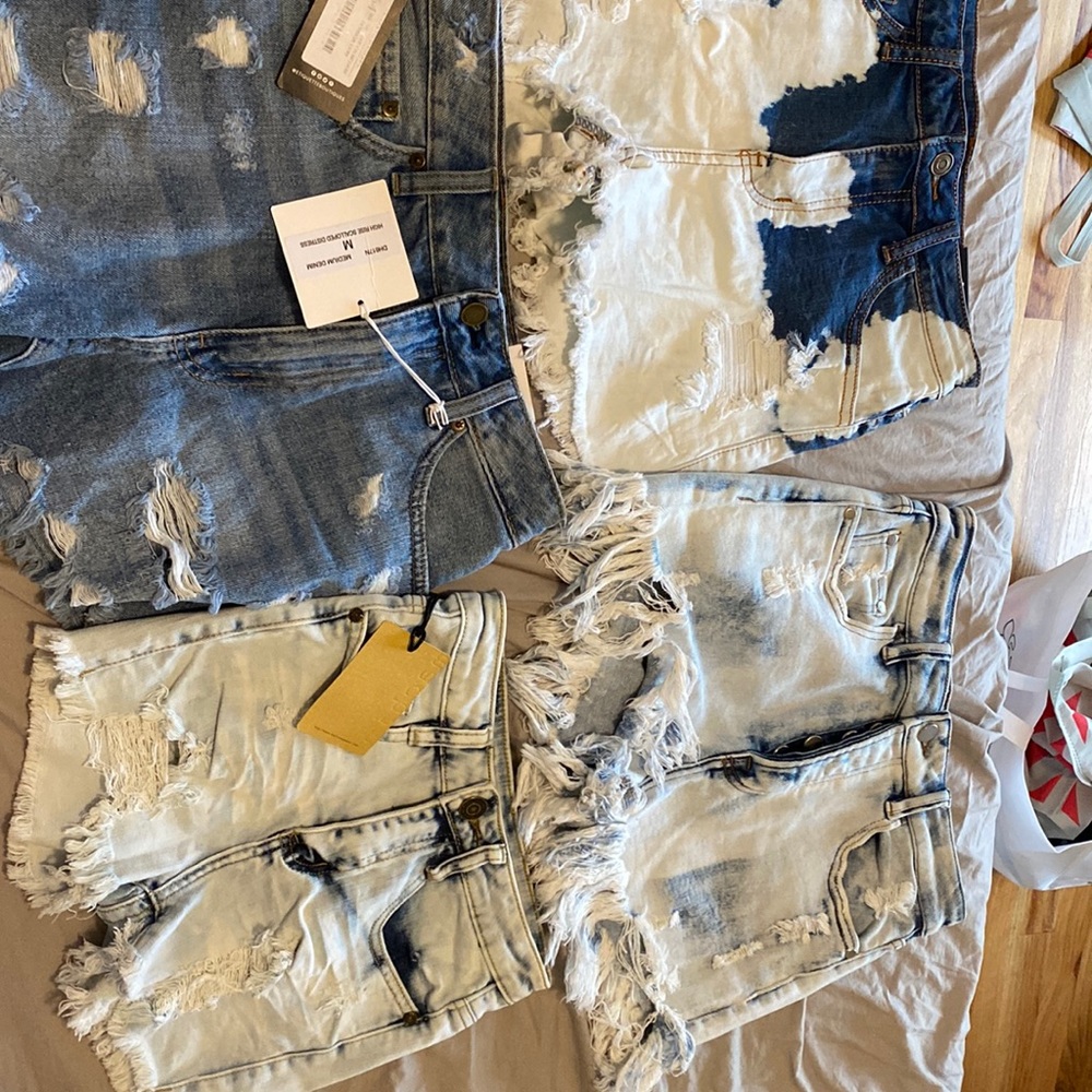 4 shorts, 3 brand new with tags. Size small and medium. Good condition